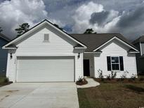 White single-Gathering home with two-car garage at 1359 Winding Creek Way, Myrtle Beach, SC 29588