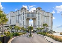Luxury resort building exterior with driveway at 100 North Beach Blvd. # 207, North Myrtle Beach, SC 29582