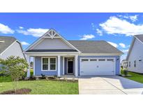 Charming one-story house with gray siding and a white garage door at 3009 Deerberry Place, Longs, SC 29568