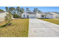 Charming one-story home with attached two-car garage at 398 Sun Colony Blvd., Longs, SC 29568