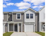 Modern two-story townhome with gray siding and white trim at 301 Sandridgebury Dr. # 68, Little River, SC 29566