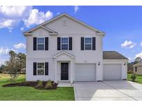 Two-story house with white siding, black shutters, and two-car garage at 1073 Kinness Dr., Conway, SC 29527