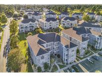 Aerial view of a community with numerous residential buildings and a pool at 4729 Wild Iris Dr. # 102, Myrtle Beach, SC 29577