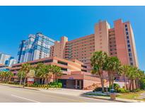 Oceanfront building with parking and palm trees at 2207 S Ocean Blvd. # 915, Myrtle Beach, SC 29577
