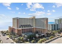 Oceanfront hotel with multiple floors and balconies at 6900 N Ocean Blvd. # 910, Myrtle Beach, SC 29572