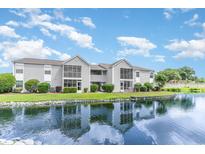 Gray siding condo building with water view at 8725 Chandler Dr. # F, Surfside Beach, SC 29575