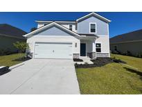 Two-story home with light blue and beige siding at 7089 Watercress St, Myrtle Beach, SC 29579