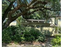 Exterior view of a house with a carport and lush landscaping at 150 Wedgefield Village Rd. # 24, Georgetown, SC 29440