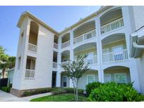 Elegant three-story building with balconies and lush landscaping at 1025 World Tour Blvd. # 101A, Myrtle Beach, SC 29579