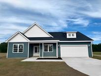 New construction home with a two-car garage at 381 Log Cabin Rd., Loris, SC 29569