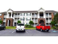 Brick apartment building with ample parking and landscaping at 3792 Hitchcock Way # 238, Myrtle Beach, SC 29577
