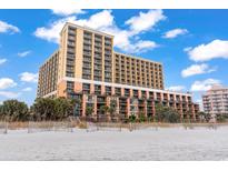 Oceanfront building with multiple levels and balconies at 6900 N Ocean Blvd. # 1401, Myrtle Beach, SC 29572