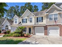 Attractive two-story home with two-car garage and landscaped front yard at 647 Riverward Dr. # 647, Myrtle Beach, SC 29588