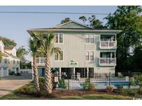 Three-story building with a private pool and a fenced backyard at 1505 Hillside Dr. # 2, North Myrtle Beach, SC 29582