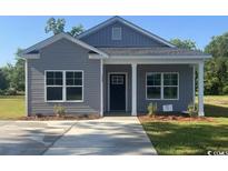 Charming gray house with a covered porch at 3486 Alton Rd., Loris, SC 29569