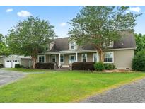 Two-story house with a covered porch at 6803 E Highway 19, Loris, SC 29569