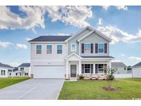 Two story home with gray and white siding, and a two car garage at 211 Wagner Cir., Conway, SC 29526