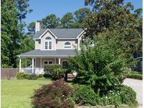 Two story house with front porch and landscaping at 134 Red Maple Dr., Pawleys Island, SC 29585