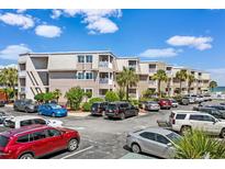 Parking area in front of building with ocean view at 9560 Shore Dr. # 3A, Myrtle Beach, SC 29572