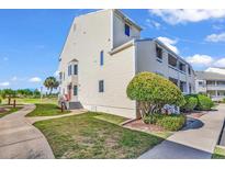 Well-maintained building exterior with landscaping and walkway at 1100 Possum Trot Rd. # C-101, North Myrtle Beach, SC 29582