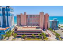 Oceanfront building with parking and surrounding landscape at 2207 S Ocean Blvd. # 1516, Myrtle Beach, SC 29577
