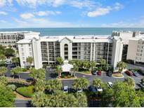 Aerial view of oceanfront condo building and parking at 669 Retreat Beach Circle # C2G, Pawleys Island, SC 29585