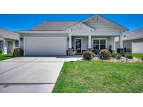 Cute one-story home with a welcoming front porch at 860 Bonita Loop, Myrtle Beach, SC 29588