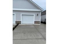 Attached garage with a white door and brick trim at 4085-C Taranto Loop # 4603 C, Myrtle Beach, SC 29579