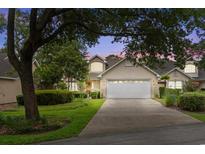 Two story home with attached garage and manicured landscaping at 723 Antigua Dr., Myrtle Beach, SC 29572