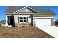 One-story house with stone accents, two-car garage, and landscaped lawn at 497 Honeyhill Loop, Conway, SC 29526