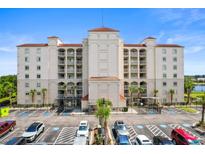 Multi-story building with parking lot and waterfront view at 2151 Bridgeview Ct. # 3501, North Myrtle Beach, SC 29582