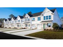 Row of charming townhouses with modern finishes and lush lawns at 8930 Brynlee Rd. # 4C, Longs, SC 29568