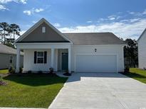 New construction home with two-car garage and landscaping at 2647 Riverboat Way, Conway, SC 29526