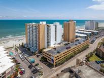 Aerial view of oceanfront high-rise building and parking at 9550 Shore Dr. # 532, Myrtle Beach, SC 29572