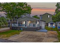 Charming single-story home with spacious deck and landscaped yard at 6001 - Mh202 S Kings Hwy., Myrtle Beach, SC 29575