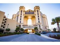Grand oceanfront building with palm trees and ample parking at 100 North Beach Blvd. # 306, North Myrtle Beach, SC 29582