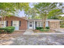 Brick ranch home with light blue accents and landscaping at 3494 Cactus St. # 3494, Myrtle Beach, SC 29577