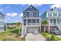 Two-story waterfront home with attached garage at 312 West Palms Dr., Myrtle Beach, SC 29579