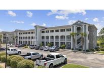 Two-story building with ample parking and landscaping at 4503 W Harbour Circle # S1, Little River, SC 29566