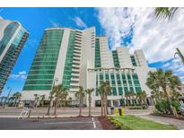 Modern high rise building with oceanfront views and palm trees at 201 S Ocean Blvd. # 1109, Myrtle Beach, SC 29577