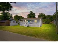 Charming cottage with a spacious front porch and well maintained lawn at 2403 Park St., North Myrtle Beach, SC 29582