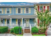 Charming two-story townhome with blue siding, white trim, and a brick walkway at 3008 Church St. # D-3, Myrtle Beach, SC 29577