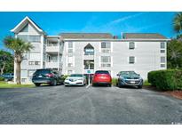 Exterior view of building with parking lot and landscaping at 351 Arrowhead Dr. # 4-113, Myrtle Beach, SC 29572