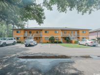 Two-story building with multiple units and parking at 1301 Pridgen Rd. # 105, Myrtle Beach, SC 29577