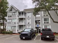 Two-story building exterior with parking in front at 351 Lake Arrowhead Rd. # 20-179, Myrtle Beach, SC 29572