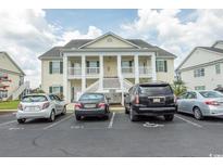 Three-story building exterior with parking in front at 4917 Twin Pond Ct. # 102, Myrtle Beach, SC 29579