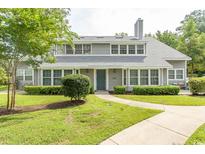Two-story home with gray siding and landscaped yard at 1206 Benna Dr. # 4-F, Myrtle Beach, SC 29577