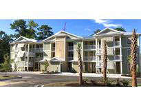 Exterior view of a three story building at 144 Puffin Dr. # 2-E, Pawleys Island, SC 29585