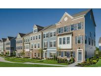 Row of three-story townhouses with neutral siding and landscaping at Tbd Swing Pl. # Tbd, Myrtle Beach, SC 29572
