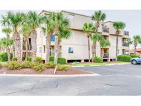 Building exterior showcasing landscaping and parking at 1582 S Waccamaw Dr. # 10, Murrells Inlet, SC 29576